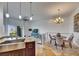 Bright, open-concept living space with modern decor and an airy feel, showcasing kitchen and dining areas at 746 Coral Reef Dr # 746, Tampa, FL 33602