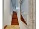 Elegant staircase with wooden steps and marble floors leading to the upper level at 746 Coral Reef Dr # 746, Tampa, FL 33602