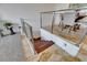 Modern staircase with metal railing and wooden steps leading up to the dining area at 746 Coral Reef Dr # 746, Tampa, FL 33602