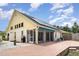 Spacious backyard with brick patio, screened porch, and ample space for grilling and outdoor seating at 7833 Ontario Street Cir, Sarasota, FL 34243