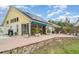 Large brick patio with screened-in porch and solar panels above, a perfect spot for outdoor gatherings and relaxation at 7833 Ontario Street Cir, Sarasota, FL 34243