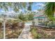 Beautiful backyard with a refreshing pool and a charming pool house, perfect for relaxation and outdoor entertaining at 7833 Ontario Street Cir, Sarasota, FL 34243