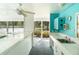 Patio bar featuring a sink and open views of the tennis court at 7833 Ontario Street Cir, Sarasota, FL 34243