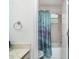 Bathroom featuring a shower with a blue curtain at 7833 Ontario Street Cir, Sarasota, FL 34243