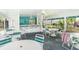 Open community space with seating, bar area, and ceiling fans for outdoor enjoyment at 7833 Ontario Street Cir, Sarasota, FL 34243