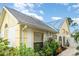 A close-up view of the home showcasing a charming exterior, beautiful landscaping, and well-placed windows at 7833 Ontario Street Cir, Sarasota, FL 34243