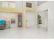 Bright foyer boasts high ceilings, tiled floors, and decorative display shelves at 7833 Ontario Street Cir, Sarasota, FL 34243