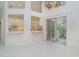 Bright, modern kitchen overlooking the living area and a cozy outdoor space, perfect for seamless entertaining at 7833 Ontario Street Cir, Sarasota, FL 34243