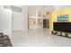 Bright living room boasts high ceilings and ample natural light with views to the modern kitchen at 7833 Ontario Street Cir, Sarasota, FL 34243