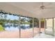 Screened-in patio with lovely view of the lake and fountain at 7833 Ontario Street Cir, Sarasota, FL 34243