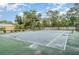 Enjoy a full size tennis court in a fully fenced outdoor area at 7833 Ontario Street Cir, Sarasota, FL 34243
