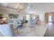 Inviting living and dining area with stylish decor, ample seating, and a warm, welcoming atmosphere at 7881 Lakes Edge Ln, Port Charlotte, FL 33981
