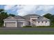 Charming single-story home with neutral colors, well-manicured lawn, and a three-car garage at 7922 Lakes Edge Ln, Port Charlotte, FL 33981