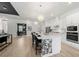 Modern kitchen with island seating, stainless appliances, and open to other living areas at 7922 Lakes Edge Ln, Port Charlotte, FL 33981