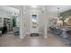 Inviting foyer with tile flooring, views of the dining and living areas, and plenty of natural light at 7970 Lakes Edge Ln, Port Charlotte, FL 33981