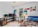 Bedroom with a desk, guitar, bed, window, and track lighting at 802 Antler Ct, Brandon, FL 33511