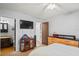 This bedroom has a tv, dresser, and entryway to an ensuite bathroom at 802 Antler Ct, Brandon, FL 33511