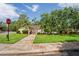 Entrance to the community pool with a pergola and lush greenery at 802 Antler Ct, Brandon, FL 33511