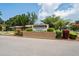 An inviting community sign featuring lush landscaping and vibrant colors, creating a welcoming atmosphere at 802 Antler Ct, Brandon, FL 33511