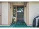 Charming front entrance featuring a decorative window and well-lit porch at 802 Antler Ct, Brandon, FL 33511