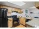 Kitchen featuring stainless appliances, granite counters and natural wood cabinets at 802 Antler Ct, Brandon, FL 33511