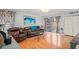 Bright living room featuring wood floors, sliding glass doors, and modern decor at 802 Antler Ct, Brandon, FL 33511