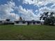 A charming single-story home with a large lawn, perfect for outdoor activities and enjoying the Florida sunshine at 802 White Heron Blvd, Ruskin, FL 33570