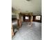 Renovated living room showcasing gray tile floors, large windows, and open floor plan at 802 White Heron Blvd, Ruskin, FL 33570