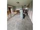 Renovated living room featuring tile flooring, and access to other rooms at 802 White Heron Blvd, Ruskin, FL 33570