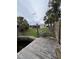Waterfront backyard with a view of the canal, boat dock, and grassy yard at 802 White Heron Blvd, Ruskin, FL 33570