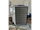 Side view of the home's air conditioning unit at 8630 134Th St, Seminole, FL 33776