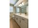 Stylish bathroom with a large vanity, modern fixtures, and a calming color scheme at 8630 134Th St, Seminole, FL 33776