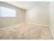 Well-lit bedroom with neutral paint, carpeted flooring, and large window bringing in natural light at 8630 134Th St, Seminole, FL 33776