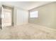 Spacious carpeted bedroom with closet and window providing ample light, enhancing the home's comfort at 8630 134Th St, Seminole, FL 33776