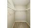 Walk-in closet featuring neutral paint, carpeted floor and wire shelving for optimal storage in a home at 8630 134Th St, Seminole, FL 33776