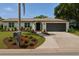 Charming single-story home with a well-manicured lawn and inviting curb appeal on a sunny day at 8630 134Th St, Seminole, FL 33776