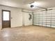 Spacious two car garage with a functional garage door, side door, and ample space at 8630 134Th St, Seminole, FL 33776