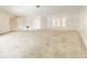 Spacious living room with neutral carpeting, and large windows for lots of natural light at 8630 134Th St, Seminole, FL 33776