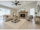 Inviting living room featuring a brick fireplace, neutral decor, and a comfortable seating area at 8630 134Th St, Seminole, FL 33776