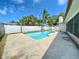 Inviting backyard pool surrounded by a well-maintained patio and lush tropical landscaping for your new home at 8630 134Th St, Seminole, FL 33776
