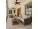Comfortable sunroom showcasing neutral furnishings, ceiling fans, and sliding glass doors at 8630 134Th St, Seminole, FL 33776