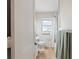 Clean bathroom with tile floors, updated fixtures, and a shower-tub combination at 918 27Th N St, St Petersburg, FL 33713