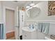 Bright bathroom featuring a stylish mirror, white vanity, and decorative accents for a charming, updated space at 918 27Th N St, St Petersburg, FL 33713