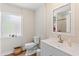 Modern bathroom featuring a vanity with a sink, a toilet, and a walk-in shower with a glass door at 918 27Th N St, St Petersburg, FL 33713