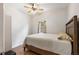 Comfortable bedroom featuring wood-look floors and a neutral color scheme at 918 27Th N St, St Petersburg, FL 33713