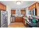 Well-equipped kitchen featuring granite countertops, stainless steel appliances, and hardwood floors at 918 27Th N St, St Petersburg, FL 33713