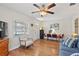 Inviting living room with hardwood floors, bright window, and stylish decor at 918 27Th N St, St Petersburg, FL 33713