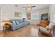 Cozy living room featuring hardwood floors, a sofa, and natural light from a window at 918 27Th N St, St Petersburg, FL 33713