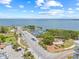 Scenic aerial view of the harbor, parking, and waterfront amenities with a backdrop of clear blue sky and open water at 1005 Main St, Safety Harbor, FL 34695