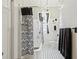 Elegant bathroom features tub/shower with decorative shower curtain, window, and vanity at 1005 Main St, Safety Harbor, FL 34695